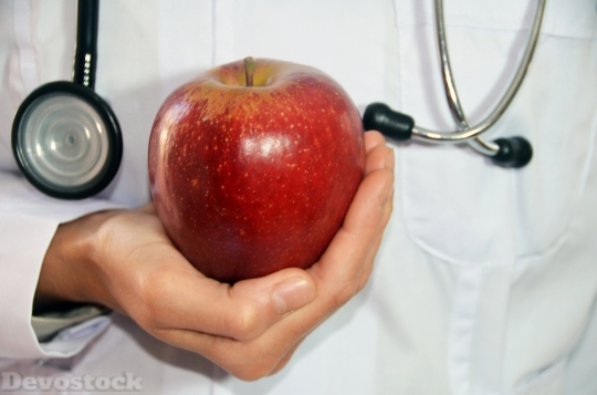 Devostock Doctor Hand Carrying Apple