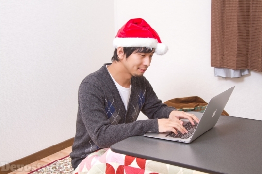 Devostock Asian Santa Claus Browsing Laptop 4k
