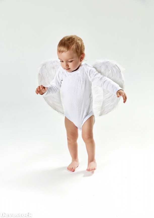 Devostock Portrait of a cute little baby angel