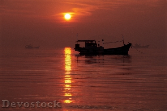 Devostock Fishing Boat Sunset