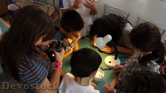 Devostock Children They Investigate Microscope HD