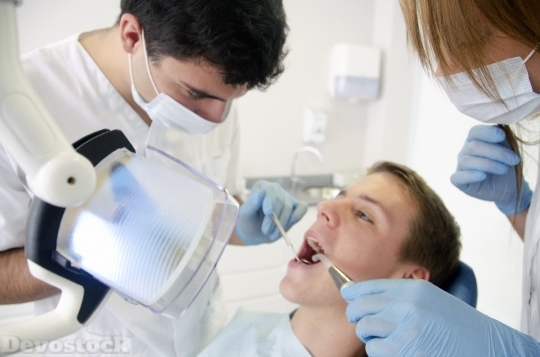Devostock Dentist Treating Teeth 4K