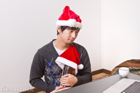 Devostock Asian Santa Claus Browsing Throwing Bottle Laptop 4k