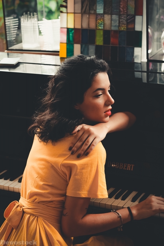 Devostock Beautiful Girl Yellow Hand Arm Playing Piano 4k