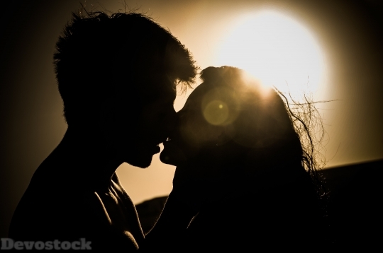 Devostock Couples Love kissing under the sunset 4k