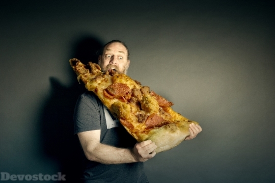 Devostock Funny Man Eating Very Huge Pizza Hungry 4K