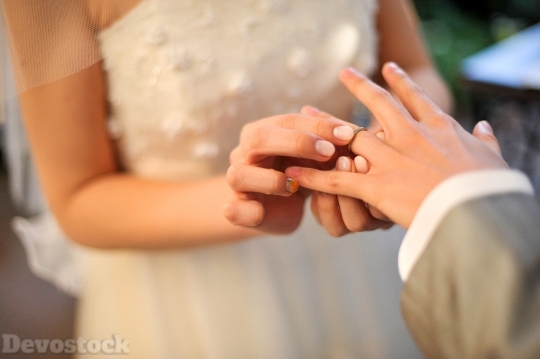 Devostock Wedding Ring Exchange Bride Groom Hands 4k