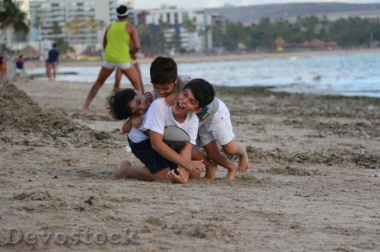 Devostock Boys playing at the beach