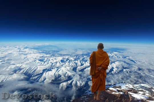 Devostock Buddhist monk on the top of a moutain Buddhism meditation