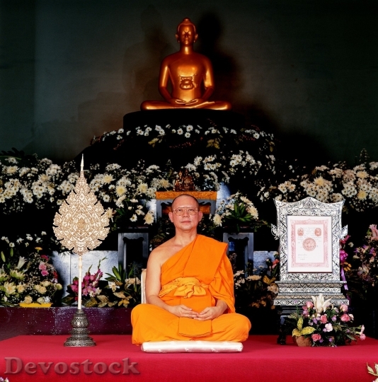Devostock Buddist man teaching in a temple 
