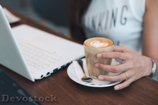 Devostock coffee latte art with woman hand