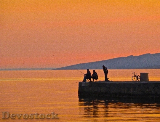 Devostock Fishing Sunset Silhouette Fisherman