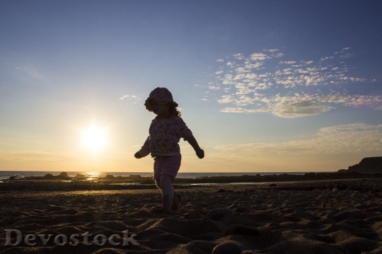 Devostock Sunset Beach Girl Child