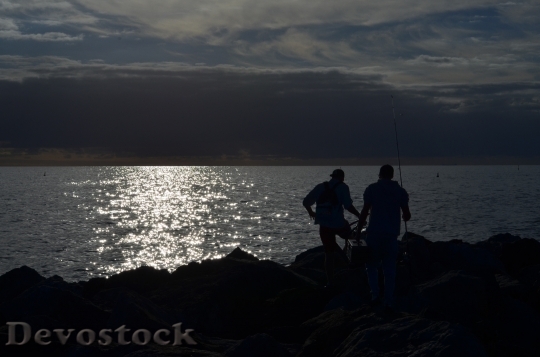 Devostock Sunset Fisherman Coast Silhouette