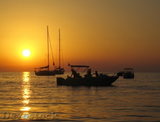 Devostock Sunset Ocean Boats Sailboat