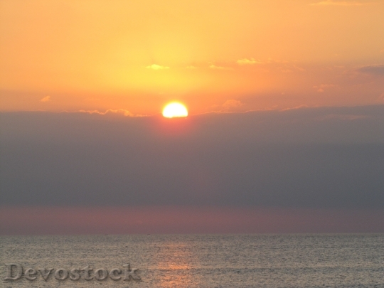 Devostock Sunset Sun Ocean Clouds