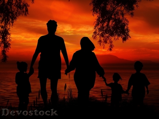 Devostock Family in the beach shadow (2)