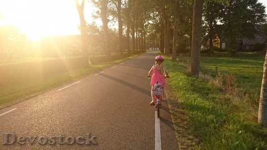 Devostock Girl riding her bicycle
