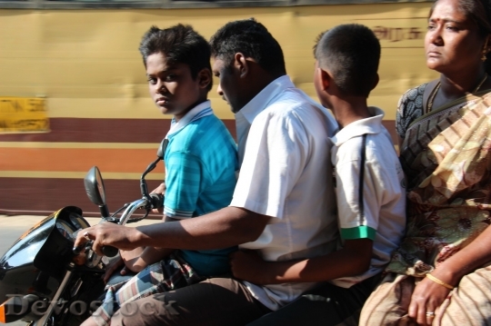 Devostock Indian family riding motorcycle