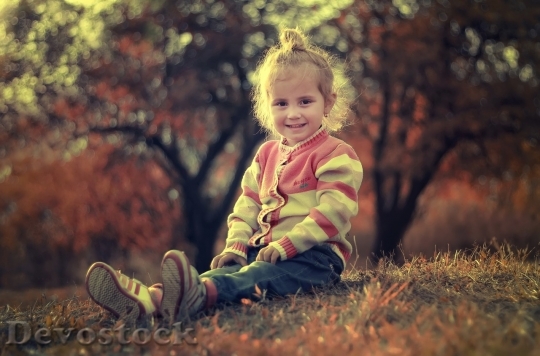Devostock Little girl smiling in the nature