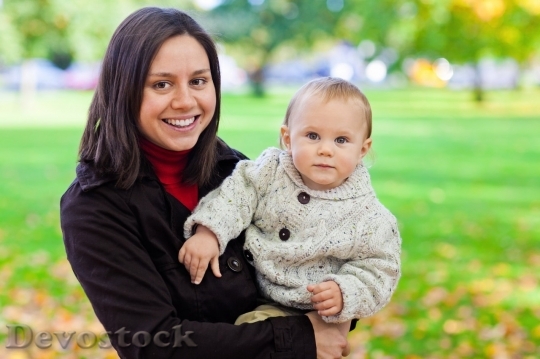 Devostock Mother holding her baby
