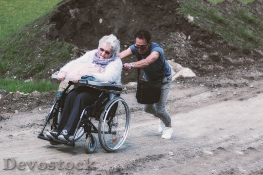 Devostock Old lady on the wheelchair