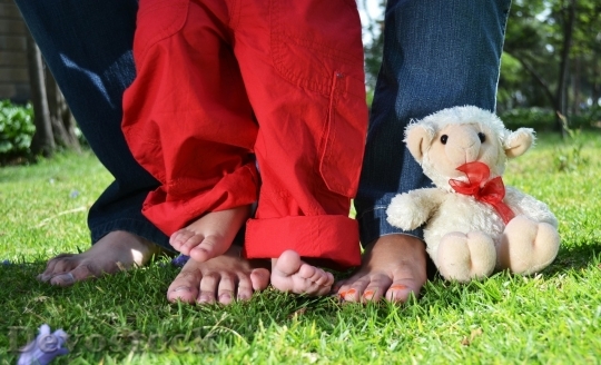 Devostock Parents and child feet 