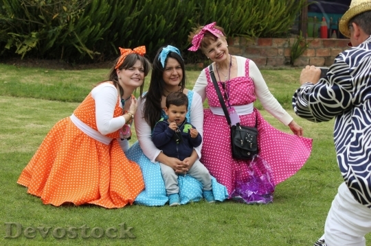 Devostock Taking picture of  lovely family wearing dresses