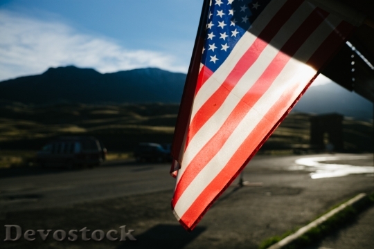 Devostock American Flag In Parking