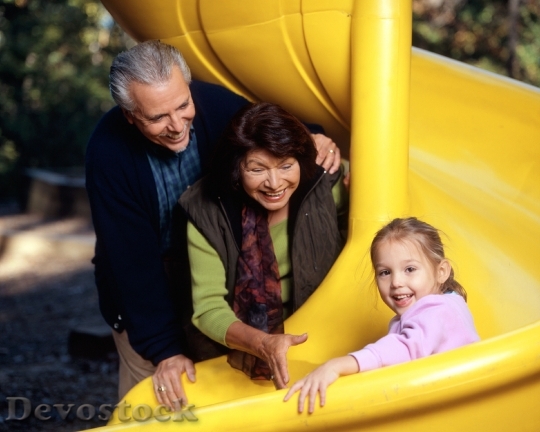 Devostock Family At Playground