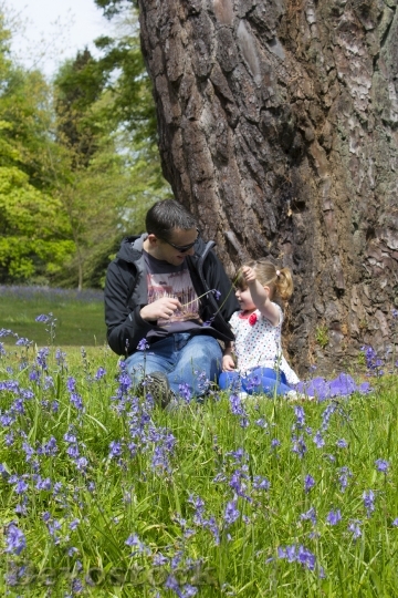 Devostock Father Daughter Bluebells Flowers