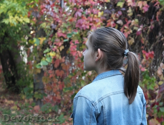 Devostock Girl Autumn Park Leaves