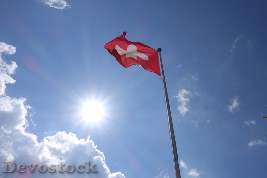 Devostock Switzerland Flag Cross Clouds