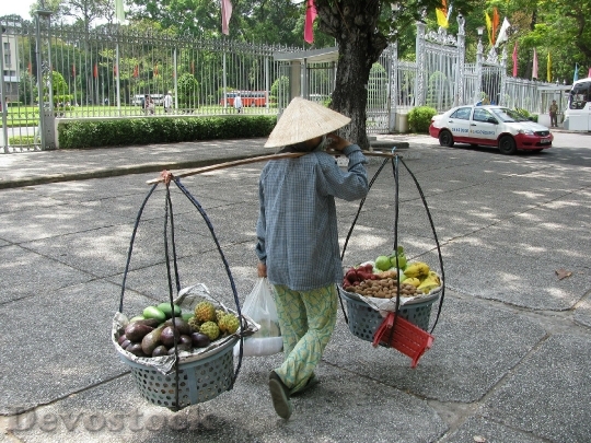 Devostock Woman Carrying Baskets