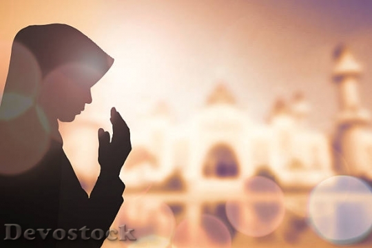 Devostock muslim-woman-pray-and-beautiful-background-picture$1