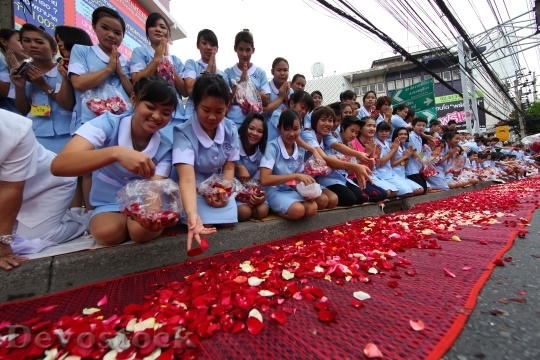 Devostock Buddhists Rose Petals Ceremony