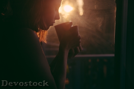 Devostock Girl Drinking Tea Coffee