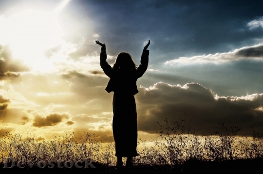 Devostock Woman Praying Believing God